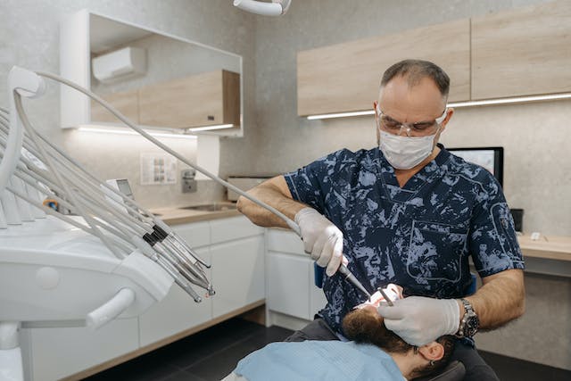 dentist fixing tooth